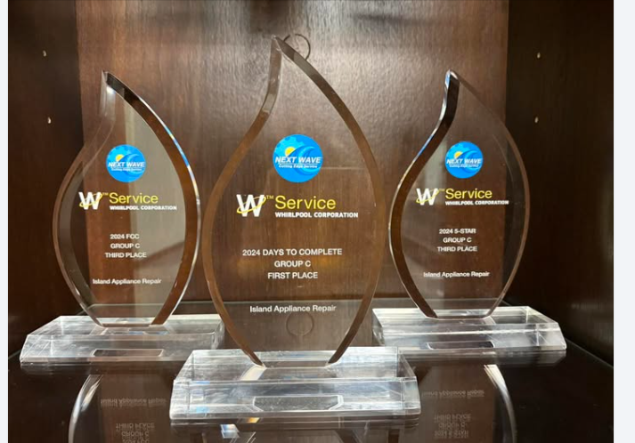 Island Appliance Repair team's Whirlpool W Service Convention award trophies